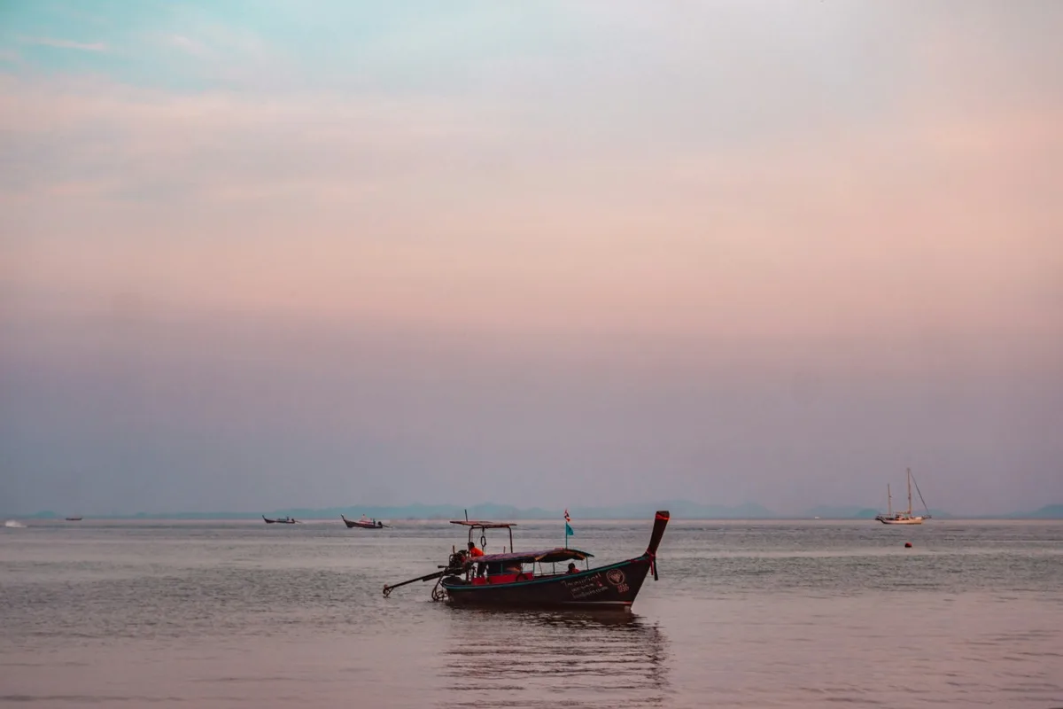 A traditional Thai boat floating off Koh Yao Noi’s coast.