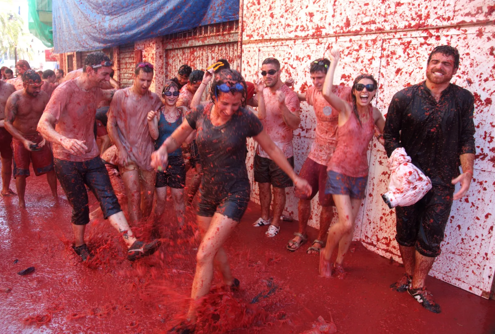 Crowds toss ripe tomatoes at the lively La Tomatina festival in Buñol, Spain.