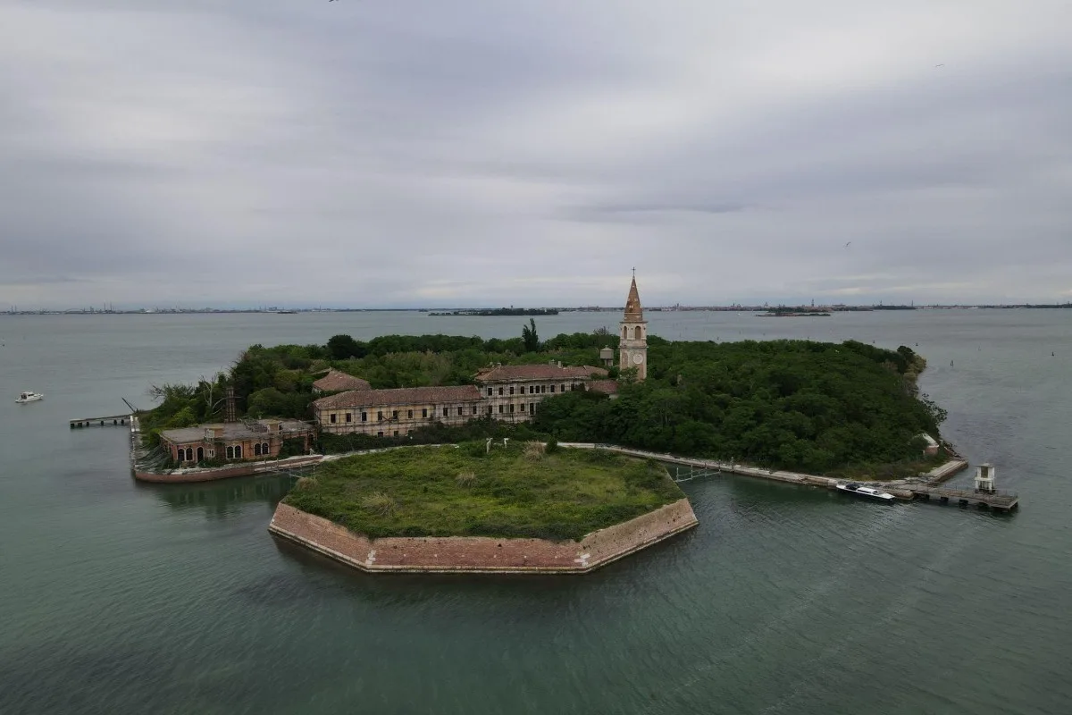 Scenic view of the abandoned Poveglia island in the Venetian Lagoon in Italy
