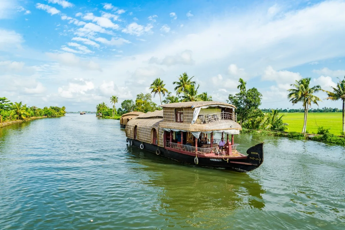Houseboats floating over the Alleyppey/Alapphuzha Backwaters  in Kerala